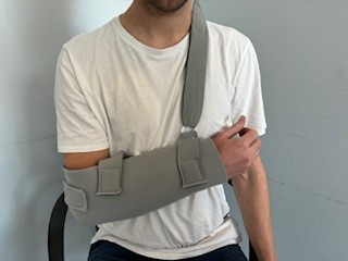 Person wearing polysling with wrist slightly elevated 