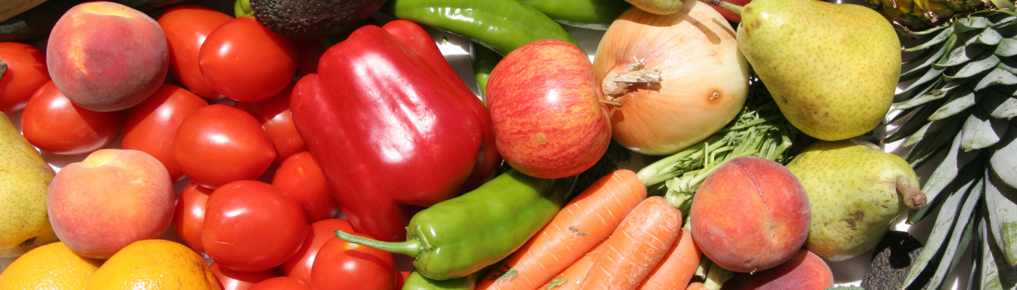 Lots of fruit and veg including peppers, pears apples, and carrots. 