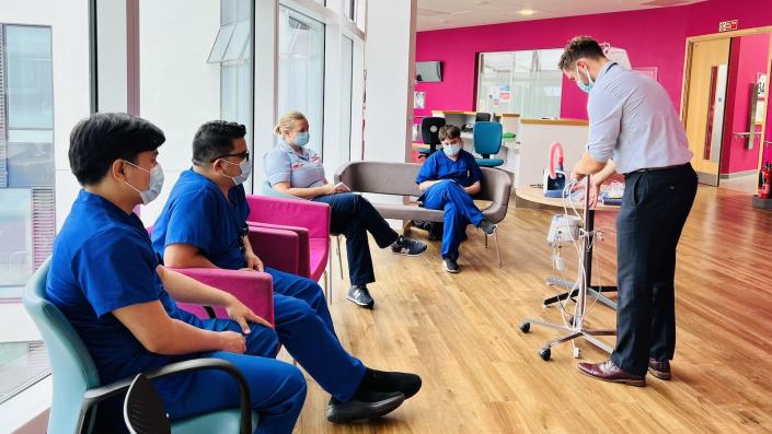 Staff in a training room with an instructor