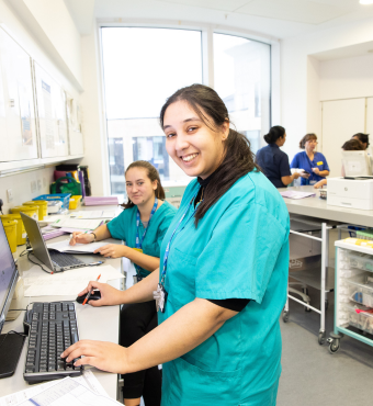 Two ward staff at computers