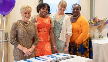 A photo of four NBT staff members and volunteers at the Volunteers Celebration Event